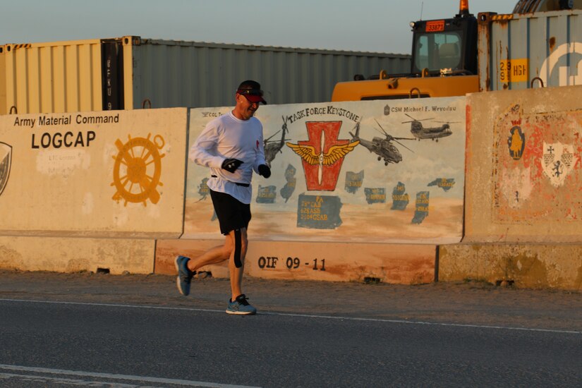 U.S. Army 1st Sgt. Gregory Chuhran, senior enlisted leader of Headquarters and Headquarters Company, 2-104th General Support Aviation Battalion, 28th Expeditionary Combat Aviation Brigade, runs during the Task Force Anvil Marathon. About 120 Soldiers raced in memory of Michael J. Novosel, Sr., a native of Etna, Pennsylvania, who served for over 40 years as an Army aviator and received the Medal of Honor for rescuing 29 Soldiers during the Vietnam War.