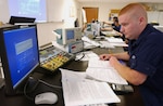 PETALUMA, Calif. (June 23, 2005) An electronics technician (ET) "A" school student at TRACEN Petaluma troubleshoots a circuit board as part of basic electronics training. USCG photo by PA1 Barry Lane.