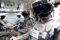 Soldiers don the Integrated Visual Augmentation System Capability Set 3 hardware while mounted in a Stryker in Joint Base Lewis-McCord, WA.