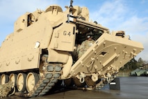 Soldiers don the Integrated Visual Augmentation System Capability Set 3 hardware while dismounting a Bradley in Joint Base Lewis-McCord, WA.