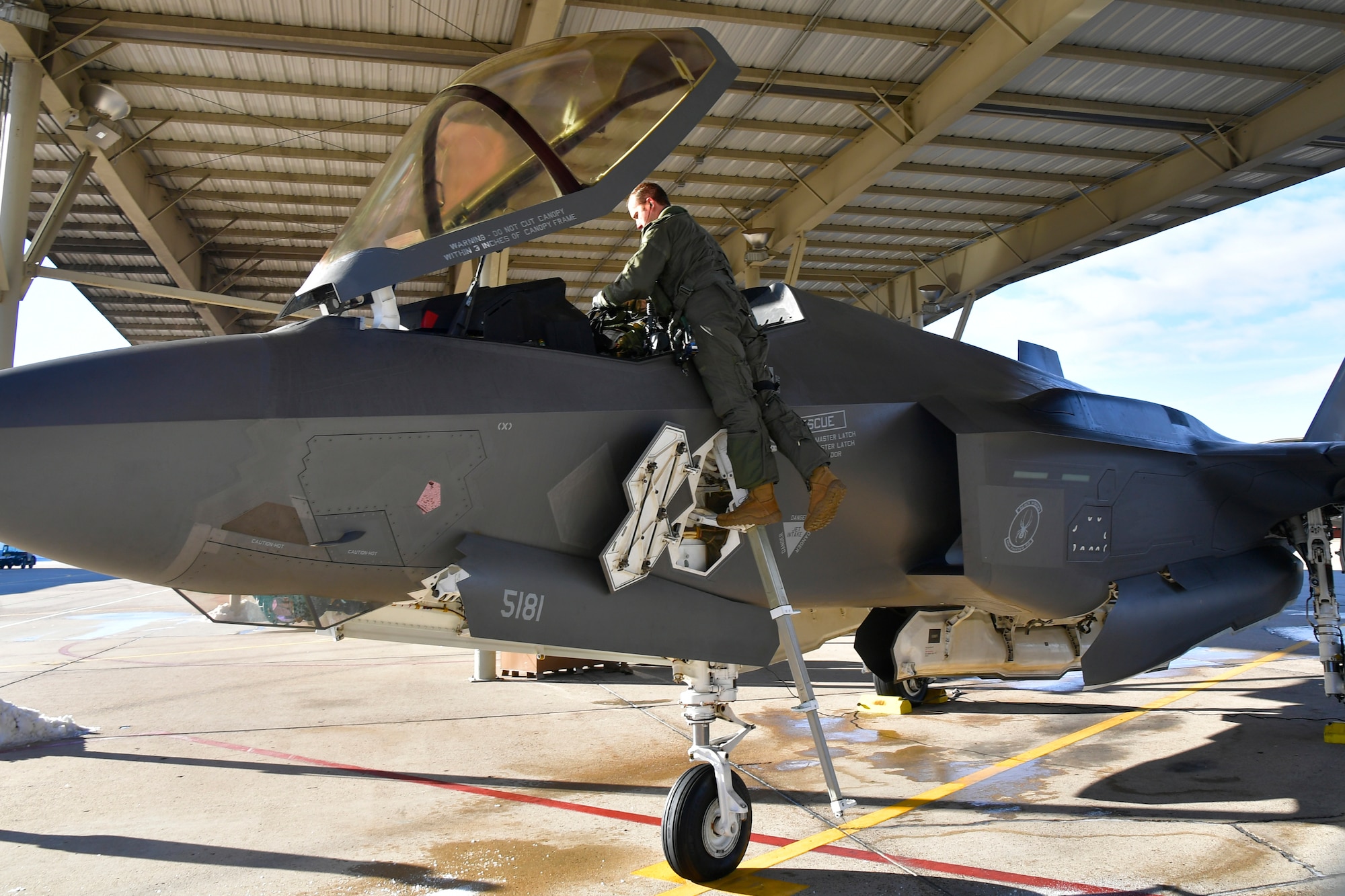 Maj. Daniel Toftness, an Air Force Reserve pilot in the 419th Fighter Wing at Hill Air Force Base, Utah, prepares for a flight Feb. 18 when he will reach 1,000 flying hours in the F-3A5 Lightning II.