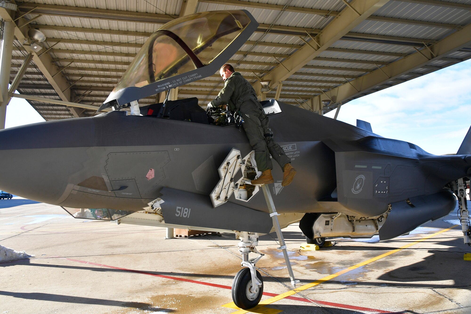 Maj. Daniel Toftness, an Air Force Reserve pilot in the 419th Fighter Wing at Hill Air Force Base, Utah, prepares for a flight Feb. 18 when he will reach 1,000 flying hours in the F-3A5 Lightning II.
