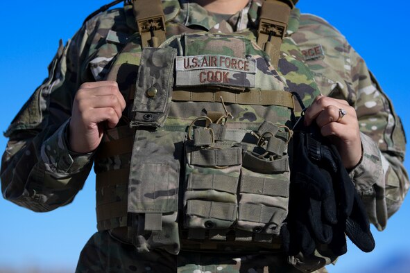 An airman wears her body armor.