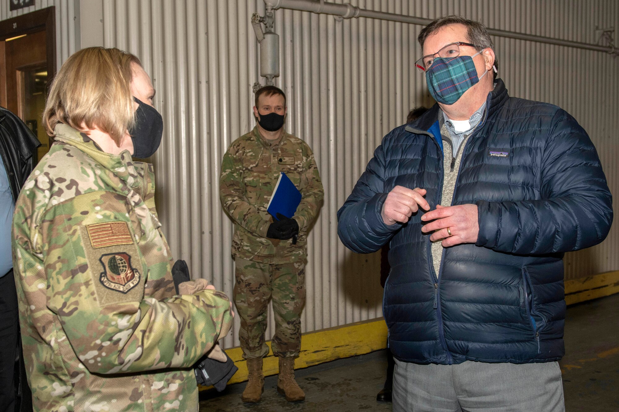 Donald Dougherty, a contracting officer assigned to the 673d Contracting Squadron, talks to U.S. Air Force Col. Kirsten Aguilar, Joint Base Elmendorf-Richardson and 673d Air Base Wing commander, during an immersion tour at JBER, Alaska, Feb. 5, 2021. Aguilar familiarized herself with the 673d CONS and its role in supporting the installation’s mission readiness after taking command of the installation July 14, 2020. The 673d CONS provides acquisition support for units across the installation by managing the purchase of supplies, services and construction.