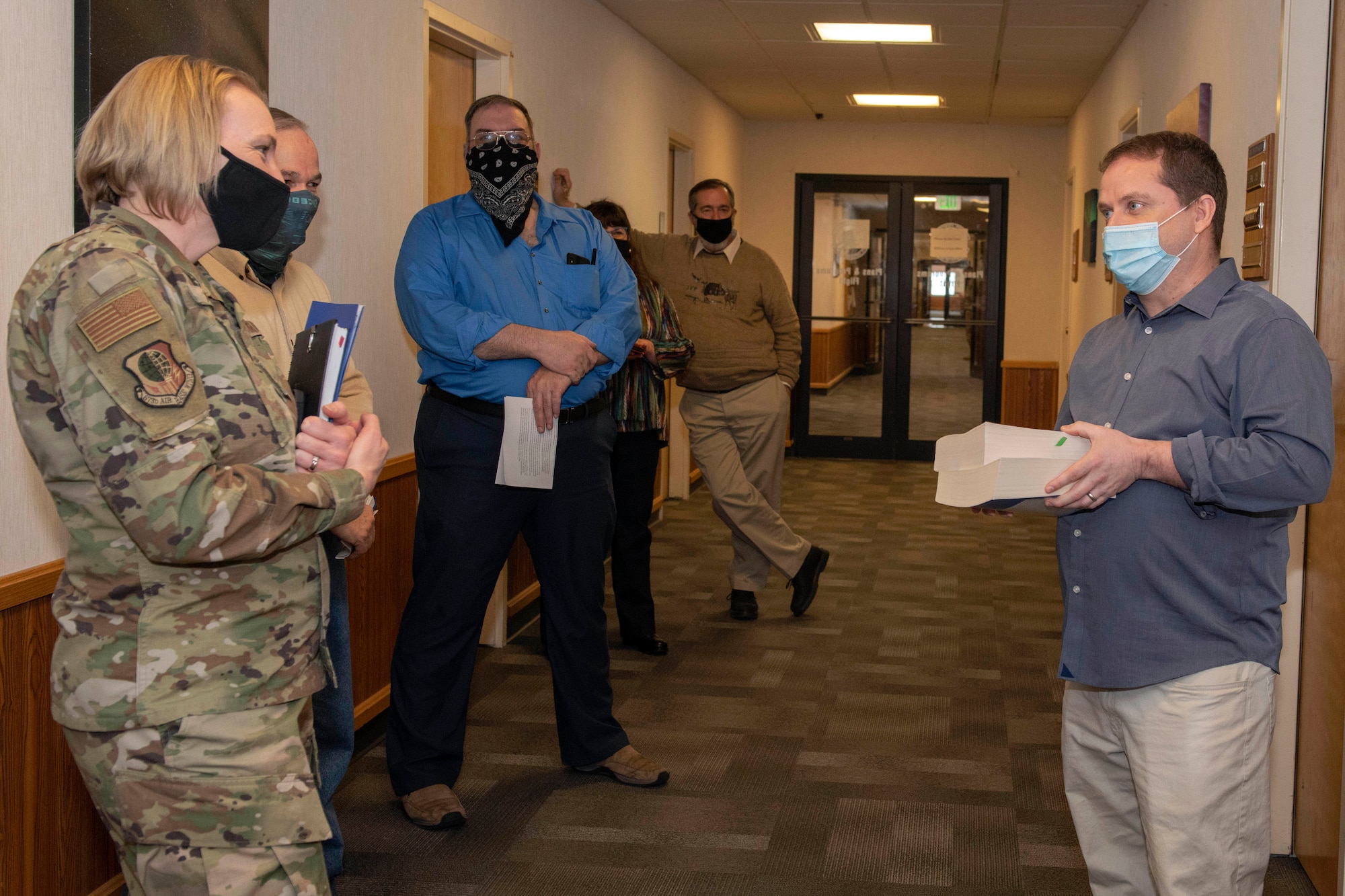 Bobby Martinez, a procurement analyst assigned to the 673d Contracting Squadron, briefs U.S. Air Force Col. Kirsten Aguilar, Joint Base Elmendorf-Richardson and 673d Air Base Wing commander, on regulations his squadron has to follow during an immersion tour at JBER, Alaska, Feb. 5, 2021. Aguilar familiarized herself with the 673d CONS and its role in supporting the installation’s mission readiness after taking command of the installation July 14, 2020. The 673d CONS provides acquisition support for units across the installation by managing the purchase of supplies, services and construction.