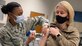 U.S. Air Force Col. Erica “Deuce” Rabe, Joint Base Anacostia-Bolling and 11th Wing vice commander, receives her second dose of the COVID-19 vaccine from U.S. Air Force Senior Airman Kiera Howard, 316th Medical Squadron family health technician, at JBAB, Washington D.C., Feb. 5, 2021. The Department of Defense is conducting a coordinated vaccine distribution strategy that will strengthen the ability to protect people, maintain readiness, support the national COVID-19 response, and trust in safe and effective vaccines and a vaccination plan. (U.S. Air Force photo by Staff Sgt. Stuart Bright)
