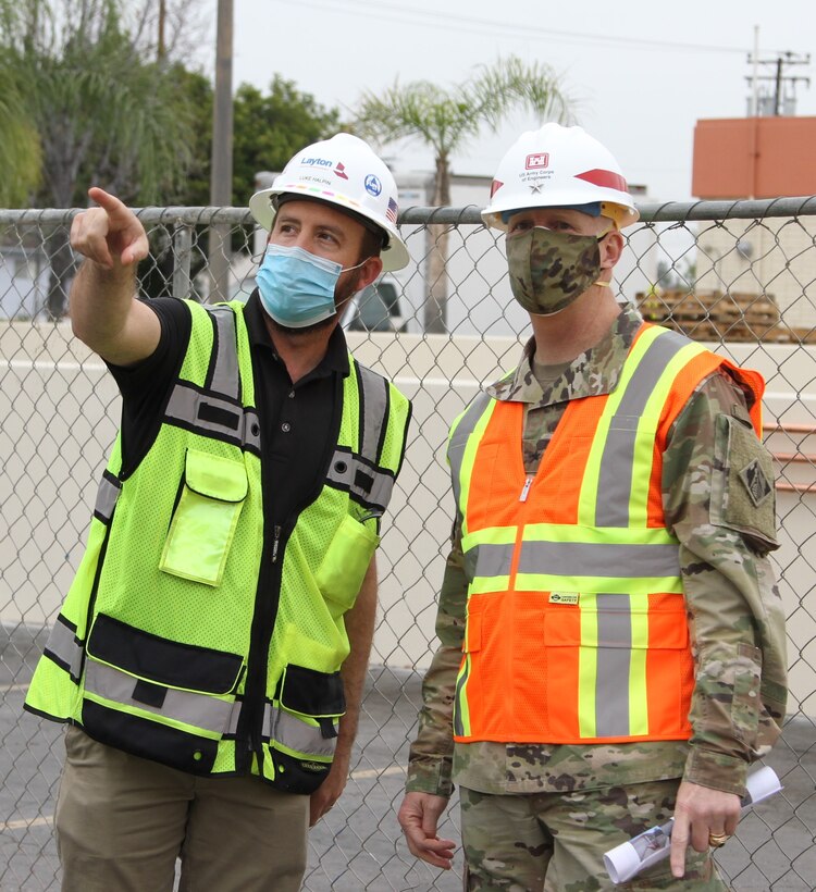 Luke Halpin, construction manager with Layton Construction Company, left, talks with Brig. Gen. Paul Owen, U.S. Army Corps of Engineers South Pacific Division commander, during Owen’s Feb. 9 visit to Beverly Community Hospital in Montebello, California, to see construction progress there, including upgrades to a 17-bed wing in the facility for non-COVID patients and the conversion of a pre-operation waiting room to a COVID staging area through the addition of high-flow oxygen.