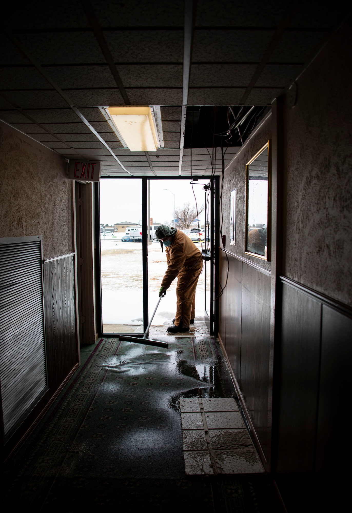 person brushes floors