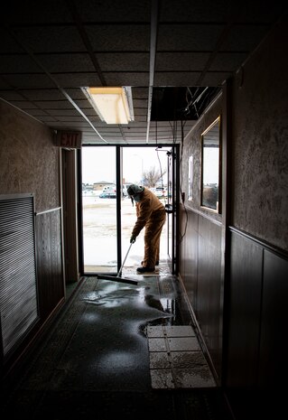 person brushes floors