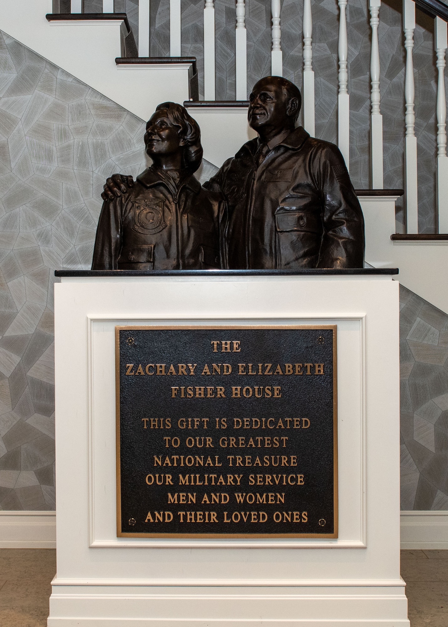 A statue of Zachary and Elizabeth Fisher stands in the foyer of Fisher House II at Joint Base Elmendorf-Richardson, Alaska, Feb. 16, 2021. The Fisher House Foundation was started in 1990 by the Fishers to provide free accommodation for families of patients receiving care at major military and Veterans Affairs medical centers.