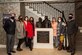Spouses of Pacific Air Forces and Joint Base Elmendorf-Richardson senior leaders pause for a photo during a visit to Fisher House II at JBER, Alaska, Feb. 16, 2021. Fisher House II opened in September 2018 and features 16 suites with private bedrooms and baths, and includes a common kitchen, dining room, living room and laundry facilities. Fisher Houses provide free accommodation for families of patients receiving care at major military and Veterans Affairs medical centers.