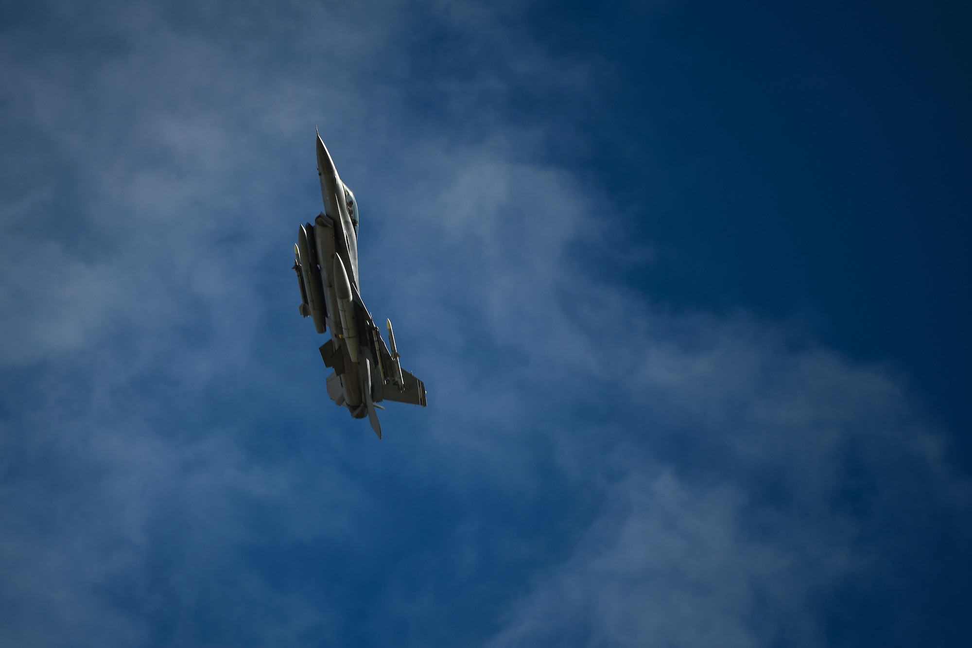 A U.S. Air Force F-16 Fighting Falcon assigned to the 510th Fighter Squadron soars above Amendola Air Base, Italy, during an Agile Combat Employment exercise, Feb. 16, 2021. During the exercise, the 555th and 510th Fighter Squadron executed counter air training with Italian air force F-35 Lightning II. (U.S. Air Force photo by Senior Airman Ericka A. Woolever)