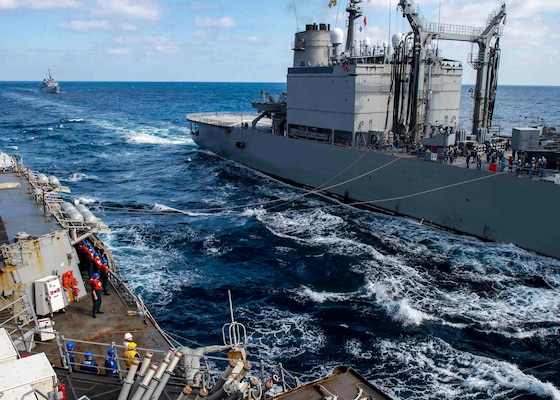 USS Curtis Wilbur (DDG 54) conducts a replenishment-at-sea with the Japan Maritime Self-Defense Force.