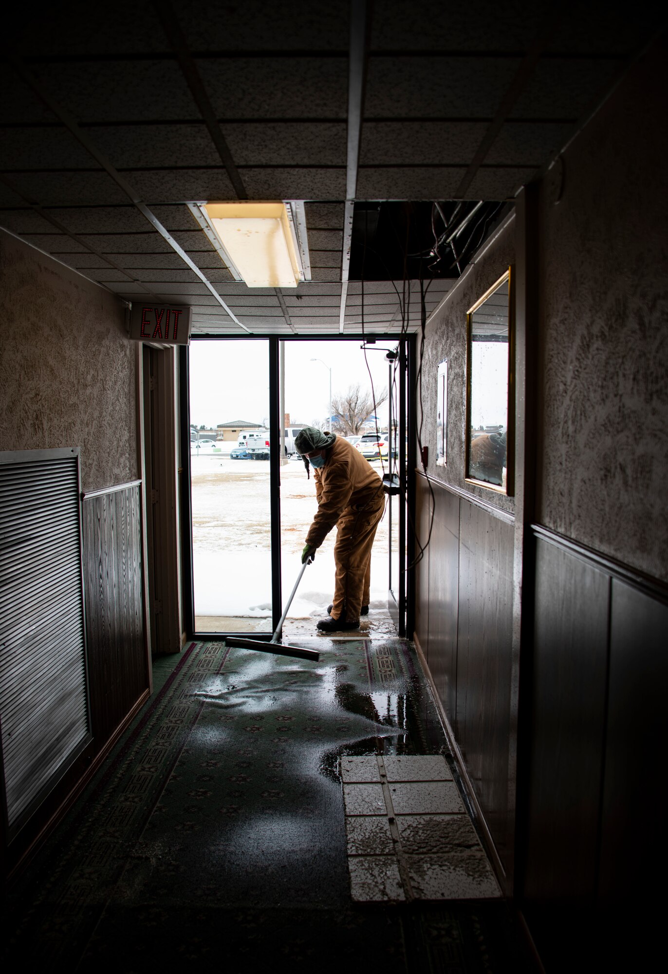 person brushes floors
