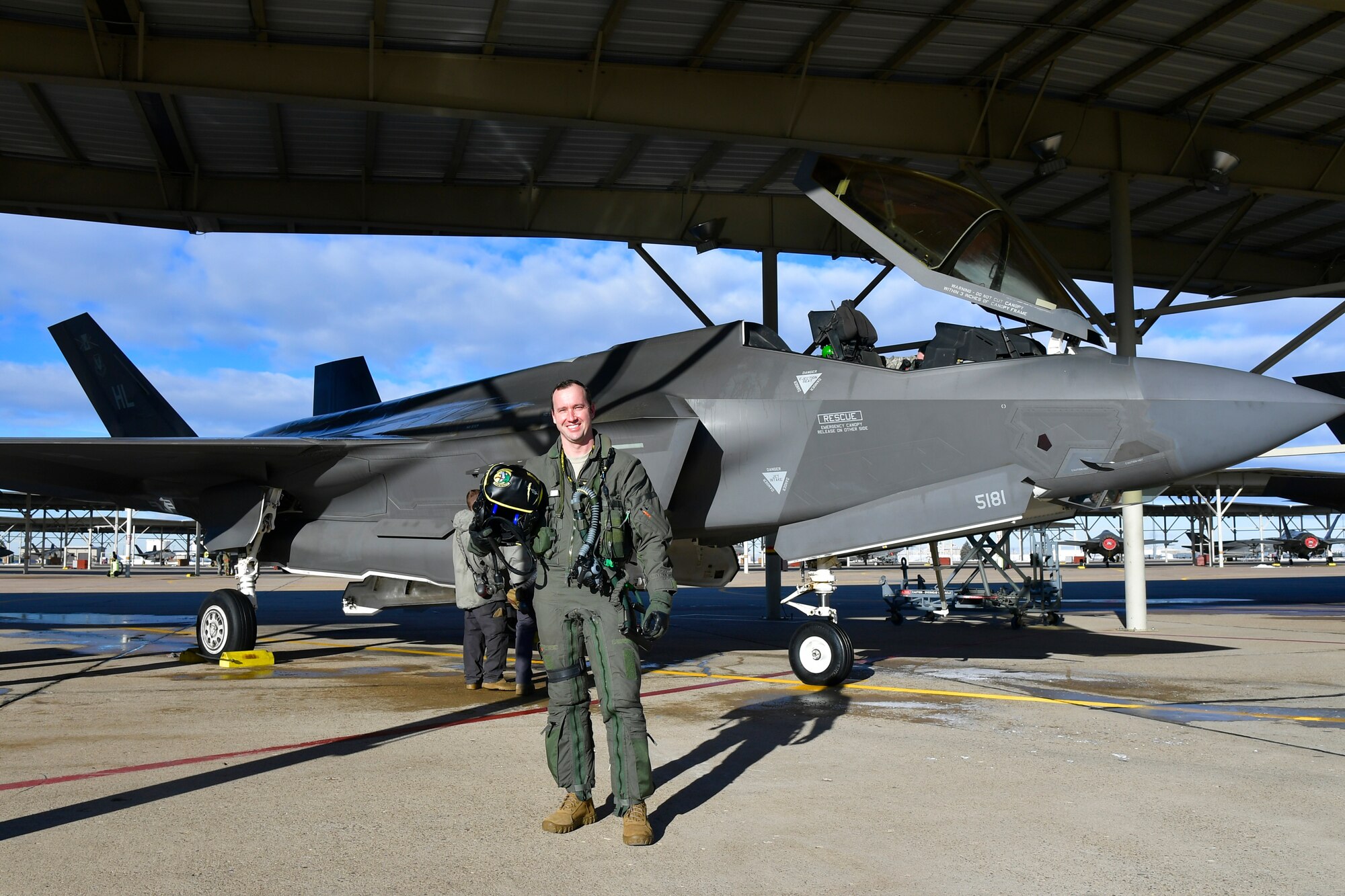 Maj. Daniel Toftness, an Air Force Reserve pilot in the 419th Fighter Wing at Hill Air Force Base, Utah, poses for a photo before for a flight Feb. 18 when he will reach 1,000 flying hours in the F-3A5 Lightning II.