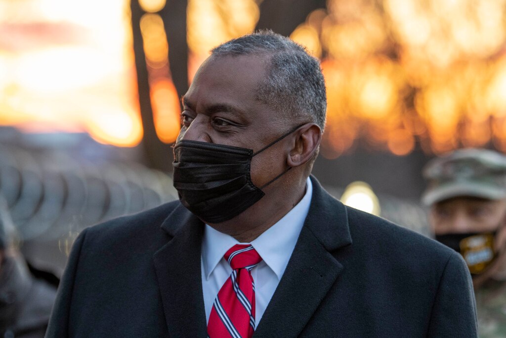 Secretary of Defense Lloyd J. Austin III stands outside the U.S. Capitol in the background.