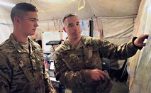 Cyber Electro-Magnetic Activities Team, 915th Cyber Warfare Support Battalion, review plans during exercise Saber Junction 2019 at the Grafenwoehr Training Area in Germany, Sept. 12, 2019.
