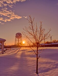 The sun sets behind the base’s water tower on Goodfellow Air Force Base, Texas, Feb. 15, 2021. The base received between five and six inches of snow with frigid temperatures. (Courtesy photo)