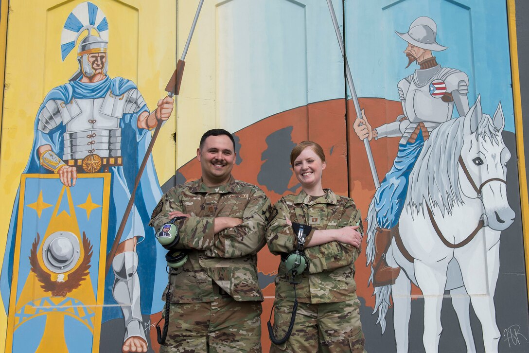U.S. Air Force Capt. Cody Martin, 727th Expeditionary Air Control Squadron chief of scheduling (left), and Capt. Kathryn Martin, 727th EACS chief of training (right), pose for a photo at Al Dhafra Air Base, United Arab Emirates, Jan. 22, 2021.