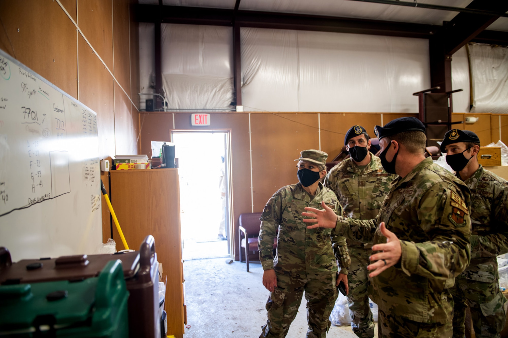 U.S. Air Force Brig. Gen. Caroline Miller (left), 502nd Air Base Wing and Joint Base San Antonio commander, receives a tour from Lt. Col. Mathew Kowalski (right), 341st Training Squadron commander, of where K-9 were stored during the cold weather Feb. 19, 2021, at Joint Base San Antonio, Texas.