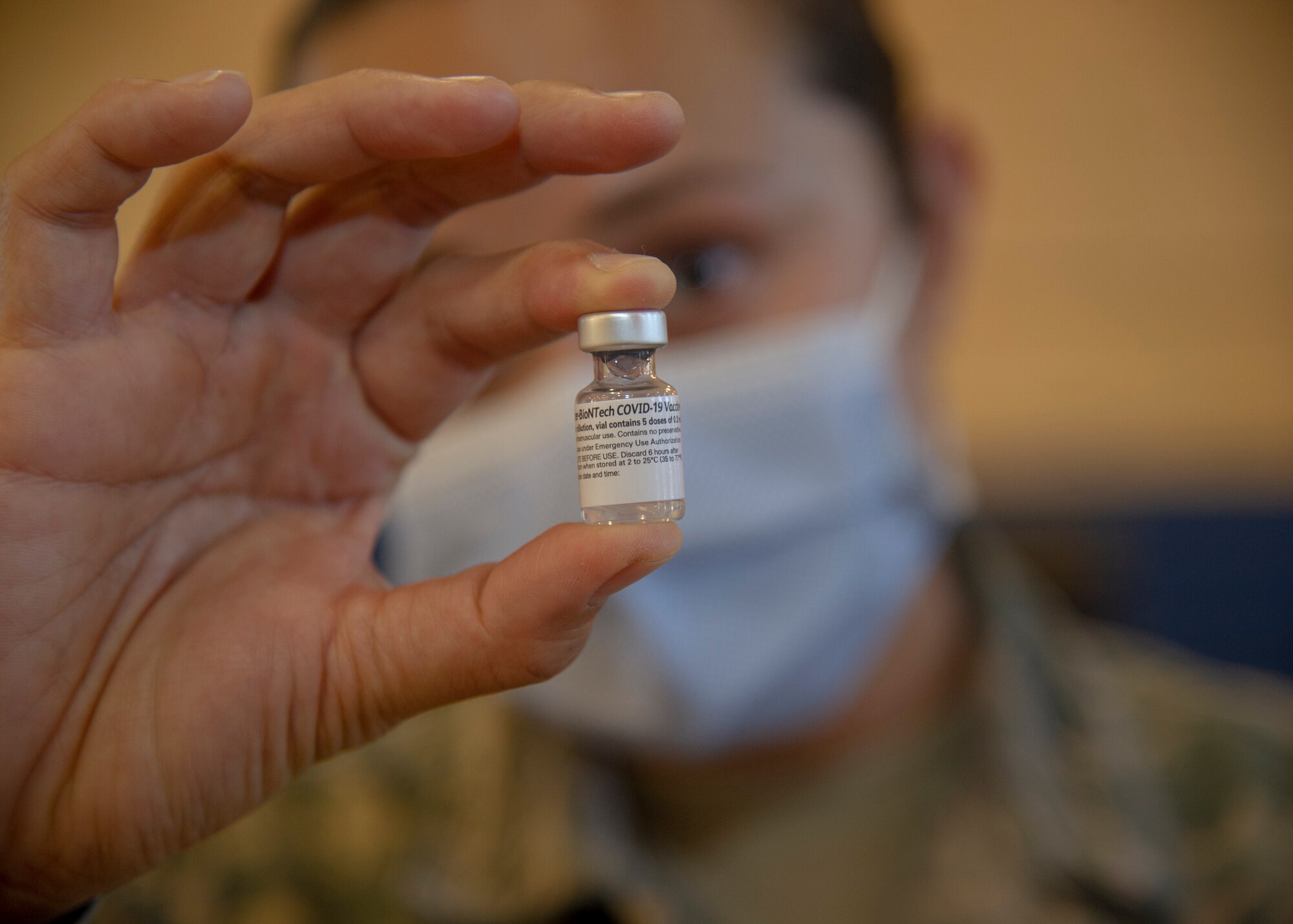 U.S. Air Force Tech. Sgt. Shannon Guerrero, 624th Aeromedical Staging Squadron (ASTS) medical technician, prepares a COVID-19 vaccine needle at a temporary vaccination site at Hickam Memorial Fitness Center on Joint Base Pearl Harbor-Hickam, Hawaii, Jan. 22, 2021.