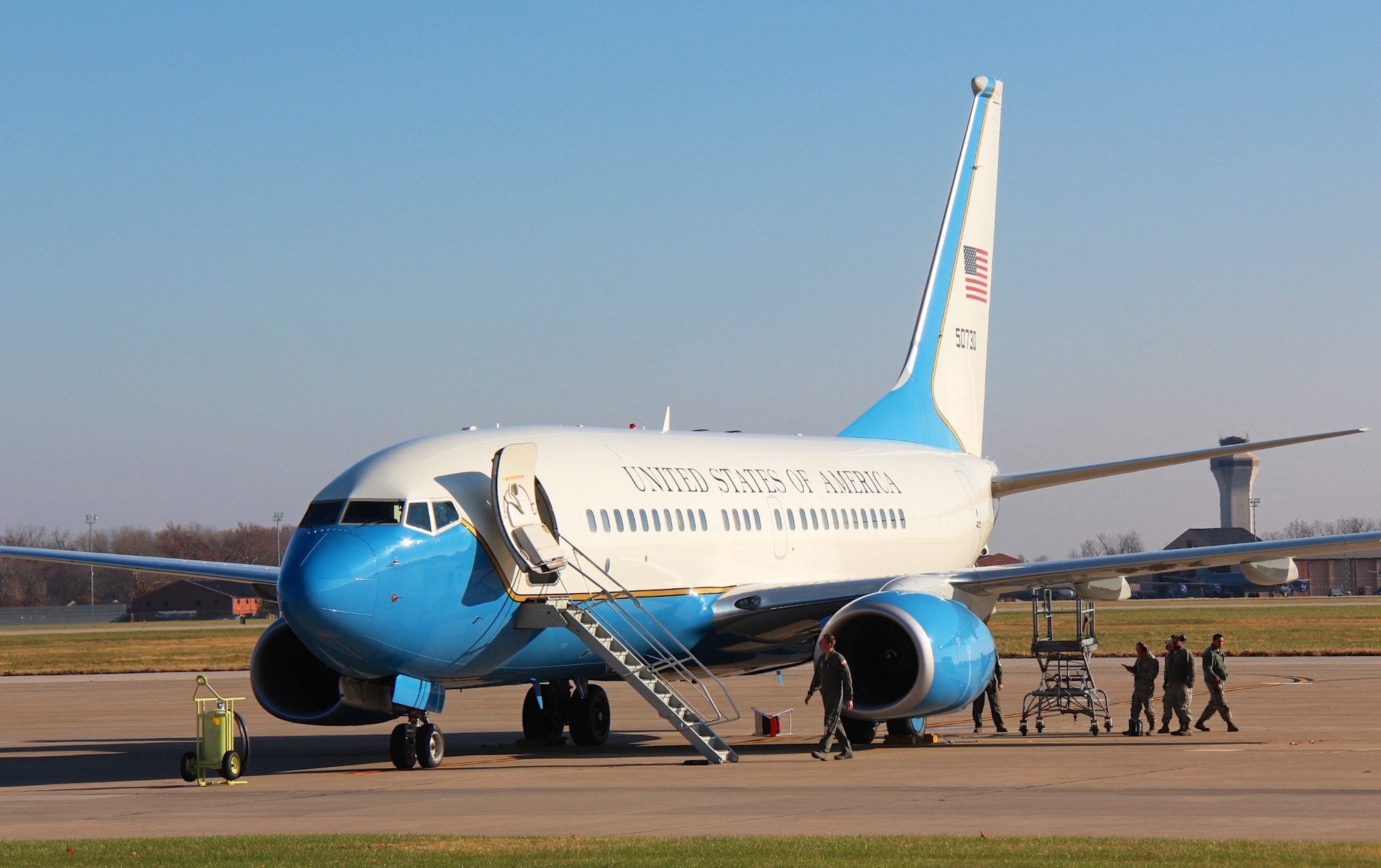 Pilots and maintainers work together on the flight line checking over a plane, as one C-40C is prepped and awaits a mission at Scott Air Force Base, Illinois. (U.S. Air Force photo by Lt. Col. Stan Paregien)