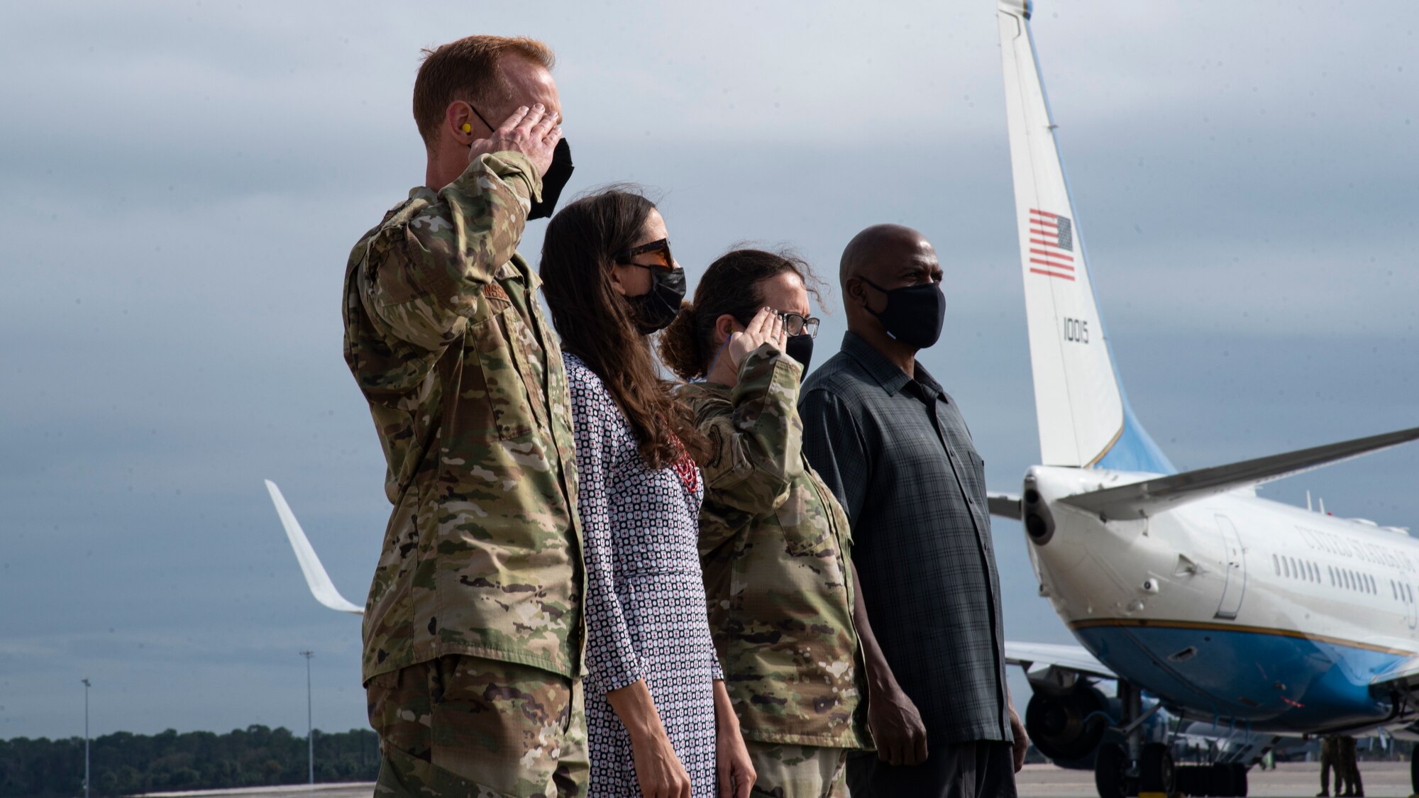 U.S. Air Force Col. Ben Jonsson, 6th Air Refueling Wing commander, and Chief Master Sgt. Shae Gee salute for the arrival of Maj. Gen. Thad Bibb Jr., 18th Air Force commander and Chief Master Sgt. Chad Bickley, 18th Air Force command chief, Feb. 17, 2021 at MacDill Air Force Base, Fla.