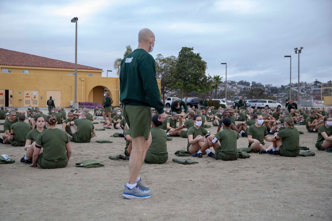 The 19th Sergeant Major of the Marine Corps, Sgt. Maj. Troy E. Black, observes the initial fitness test of the first gender integrated company at Marine Corps Recruit Depot San Diego, Ca, Feb. 12, 2021. The Sergeant Major of the Marine Corps conducted the visit to observe the integrated training and to speak to Depot staff. The Depot's primary function is to take quality young men and women from the western two-thirds of the United States and transform them through the foundations of rigorous basic training, our shared legacy, and a commitment to our Core Values, preparing them to win our Nation’s battles in service to the country. (U.S. Marine Corps photo by Sgt. Victoria Ross)