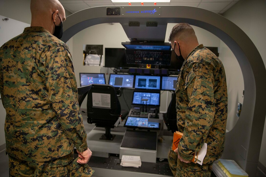 The 19th Sergeant Major of the Marine Corps, Sgt. Maj. Troy E. Black, tours the Center for Naval Aviation Technical Training (CNATT) at Marine Corps Air Station Cherry Point, Nc, Feb. 17, 2021. The Sergeant Major of the Marine Corps conducted the visit to look at the live virtual constructive training implemented at CNATT. The CNATT mission is to develop, deliver, and support aviation training necessary to meet validated fleet requirements through a continuum of professional and personal growth for Sailors and Marines. (U.S. Marine Corps photo by Sgt. Victoria Ross)