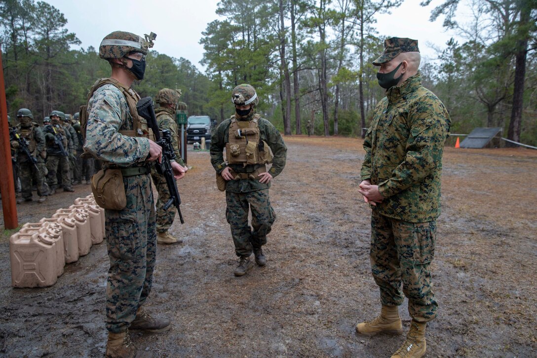 The 19th Sergeant Major of the Marine Corps, Sgt. Maj. Troy E. Black, observes Marines executing a live-fire range as part of the Basic Infantry Marine Course at Marine Corps Base Camp Lejeune, Nc, Feb. 18, 2021. The Sergeant Major of the Marine Corps conducted the visit to see how the current period of instruction is being taught at School of Infantry East. The mission of Infantry Training Battalion is to train and qualify Marines in entry-level infantry military occupational specialties in order to provide the Operating Forces and Reserve Component with Marines capable of conducting expeditionary combat operations. (U.S. Marine Corps photo by Sgt. Victoria Ross)