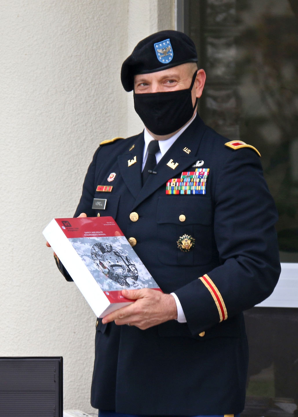 Col. Thomas J. Verell, Jr. places an item into a time capsule.