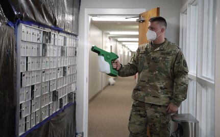 Spc. Quinton Boyd, assigned to a Facility Assistance Support Team, Kentucky National Guard, sanitizes mailboxes with an electrostatic sprayer at Sayre Christian Village, Lexington, Ky., Feb. 3, 2021. Gov. Andy Beshear directed troops to supplement long-term health care facilities in COVID-19 hot spots throughout Kentucky.