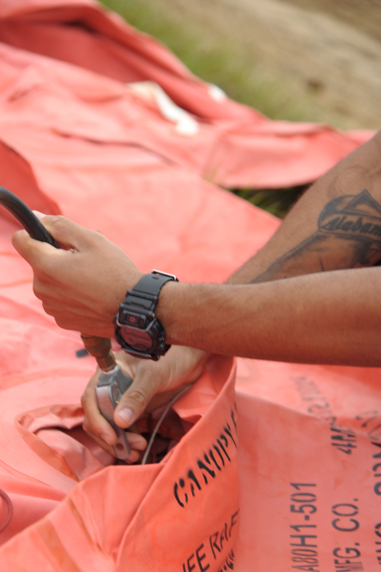 Technical Sgt. Mark Hugeley, 908th Operations Support Squadron, aircraft flight equipment technician, uses a compressor to inflate a 20-person life raft Nov. 8, 2020, at Maxwell Air Force Base, Alabama.