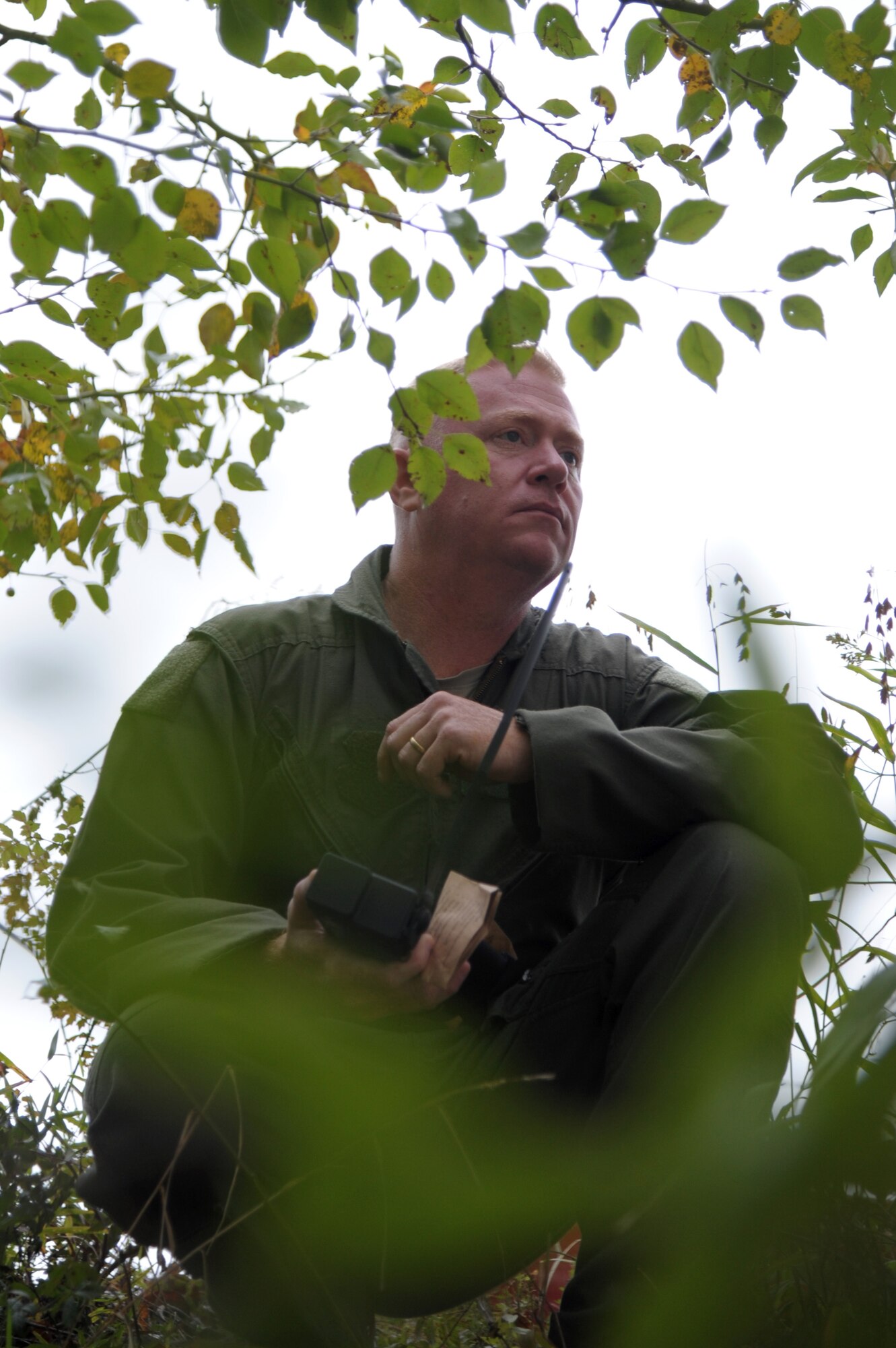 Senior Master Sgt. Adam Childers, 357th Airlift Squadron flight engineer, scouts for the rescue pickup from a concealed area Nov. 8, 2020, at Maxwell Air Force Base, Alabama.