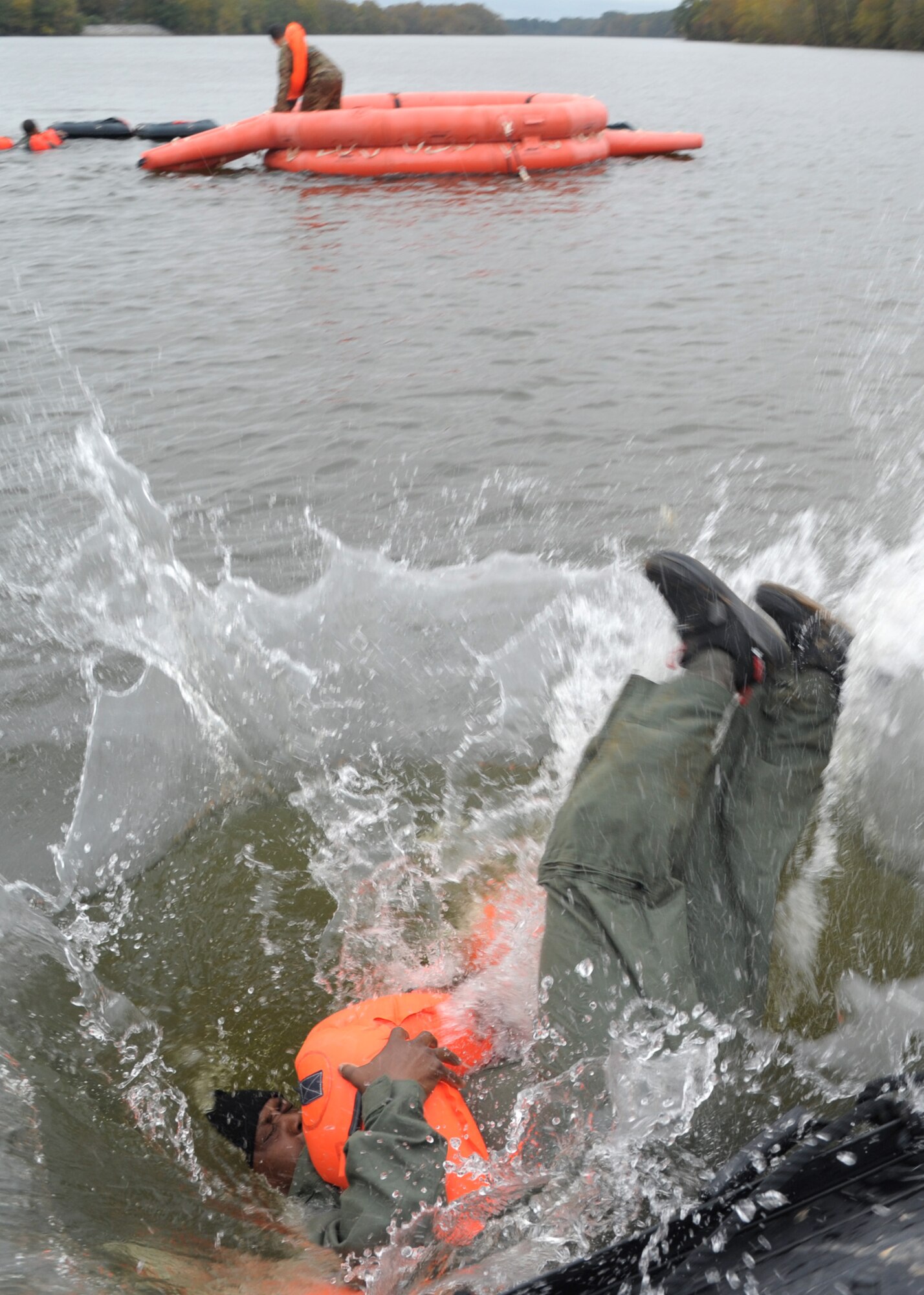 Master Sgt. Cedric Robins, 908th Operations Support Squadron loadmaster, dives into the Alabama River Nov. 8, 2020, at Maxwell Air Force Base, Alabama.
