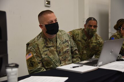 Virginia National Guard Soldiers assigned to the Recruiting and Retention Battalion talk to Soldiers about retention as they out-process following their support to law enforcement in Washington, D.C., Jan. 25, 2021, at Fort Pickett, Virginia. (U.S. Army National Guard photo by Sg. 1st Class Terra C. Gatti)