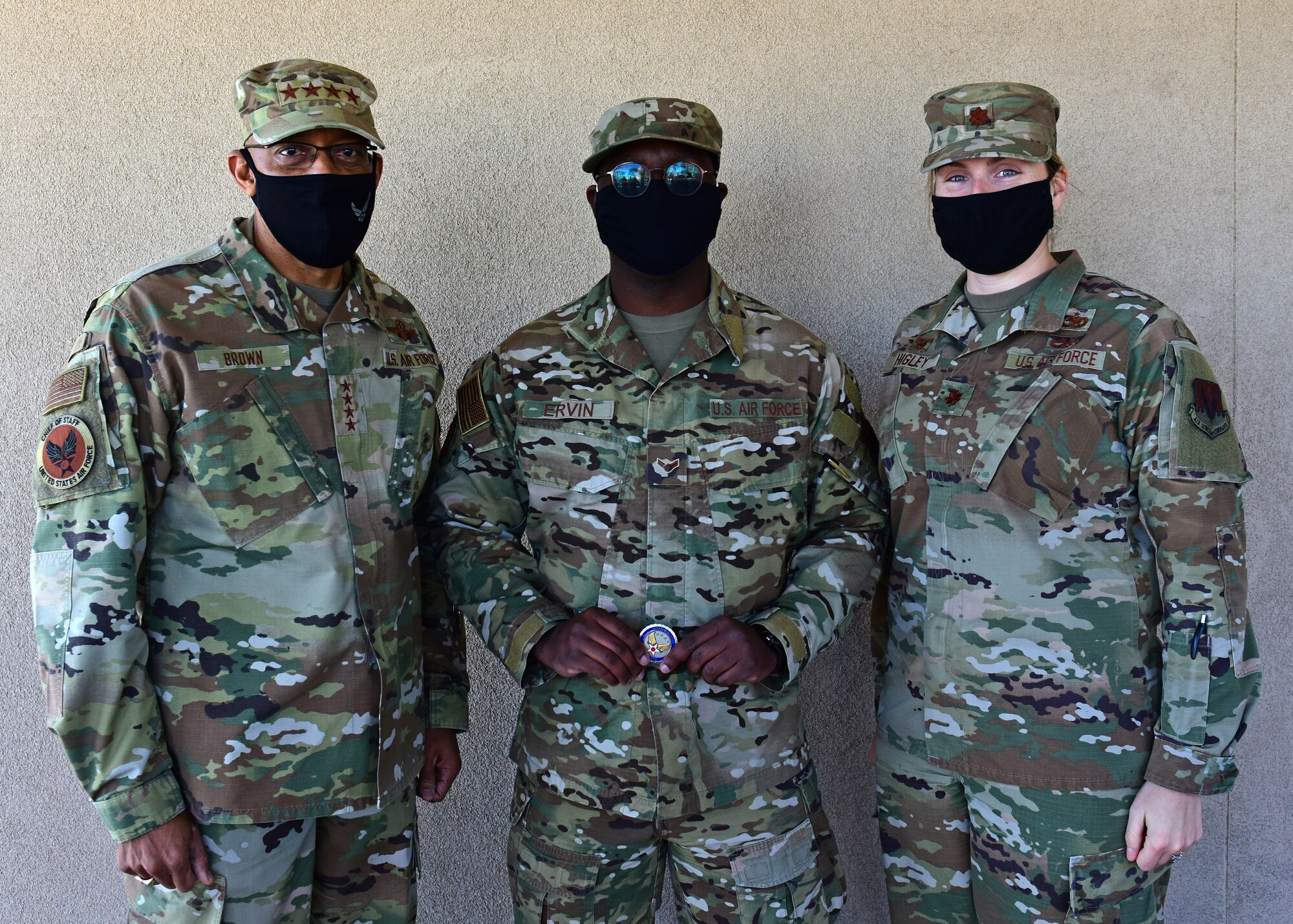 Air Force Chief of Staff, Gen. Charles Q. Brown poses for with Airmen at Davis-Monthan Air Force Base.