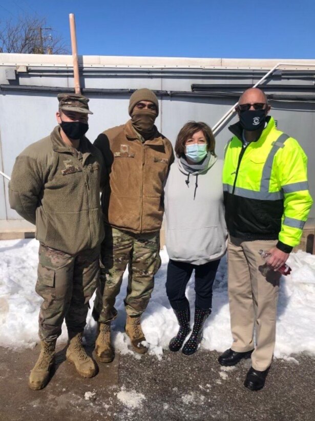 Staff Sgt. Matthew Graves, 82nd Logistics Readiness Squadron/Traffic Management Operations Cargo operations supervisor and Maj. Aaron Green, 82nd LRS operations officer, pose for a photo with Meals On Wheels volunteer leaders in Wichita Falls, Texas, Feb. 19, 2021. Meals On Wheels helped feed around 1,000 people during the aftermath of the winter storm in the Wichita Falls area. The volunteer group for this effort was comprised of over 200 members from various Wichita County public service departments, active and guard military members and countless other individuals from the local community.(Courtesy Photo)