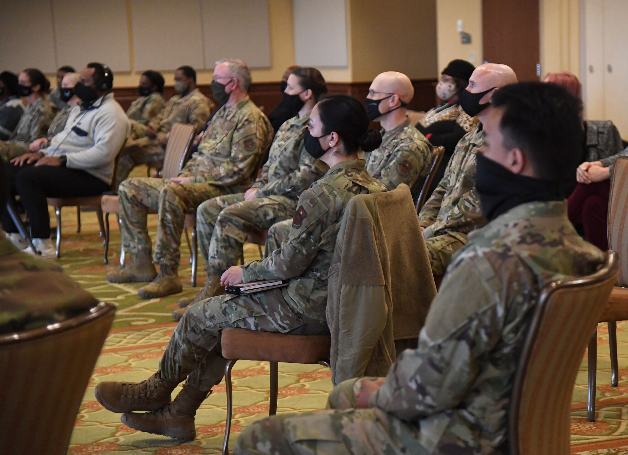 Keesler personnel attend the National African American History Month celebration inside the Bay Breeze Event Center at Keesler Air Force Base, Mississippi, Feb. 18, 2021. Rip Daniels, WJZD radio station CEO and "It's a New Day" host,  served as the keynote speaker at the event. (U.S. Air Force photo by Kemberly Groue)