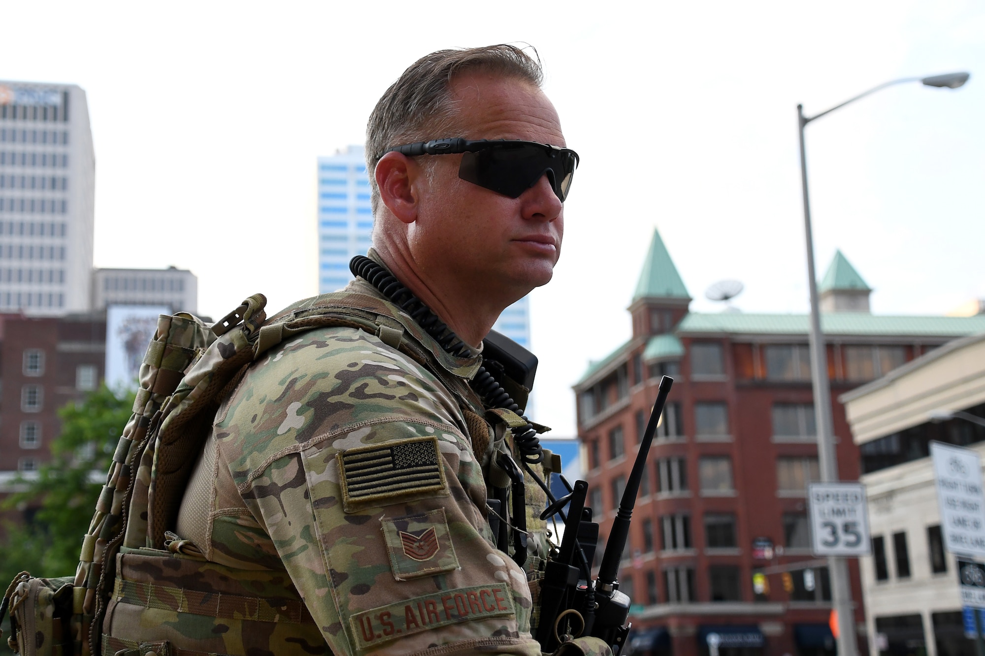 Tech. Sgt. Jack Shaw, a defender assigned to the 178th Security Forces Squadron, monitors operations June 5, 2020, in downtown Columbus, Ohio. About 25 members from the 178th SFS were activated to support Operation Guardian Serenity III, with Ohio National Guard personnel augmenting local law enforcement to provide safety and protection to community members during protests in Columbus and Cleveland. (U.S. Air National Guard photo by Staff Sgt. Amber Mullen)