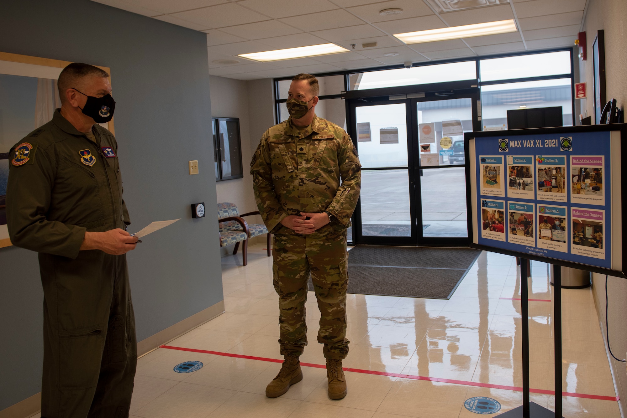 Lt. Col. Jonathan Semple, 47th Medical Group administrator, briefs Maj. Gen. William Spangenthal, Air Education and Training Command deputy commander, during his tour of the 47th Medical Group at Laughlin Air Force Base, Texas, Feb. 9, 2021. Semple explained how the Team XL MAX VAX COVID-19 vaccination plan has enabled sustained operations across the installation. (U.S. Air Force photo by Airman 1st Class David Phaff)