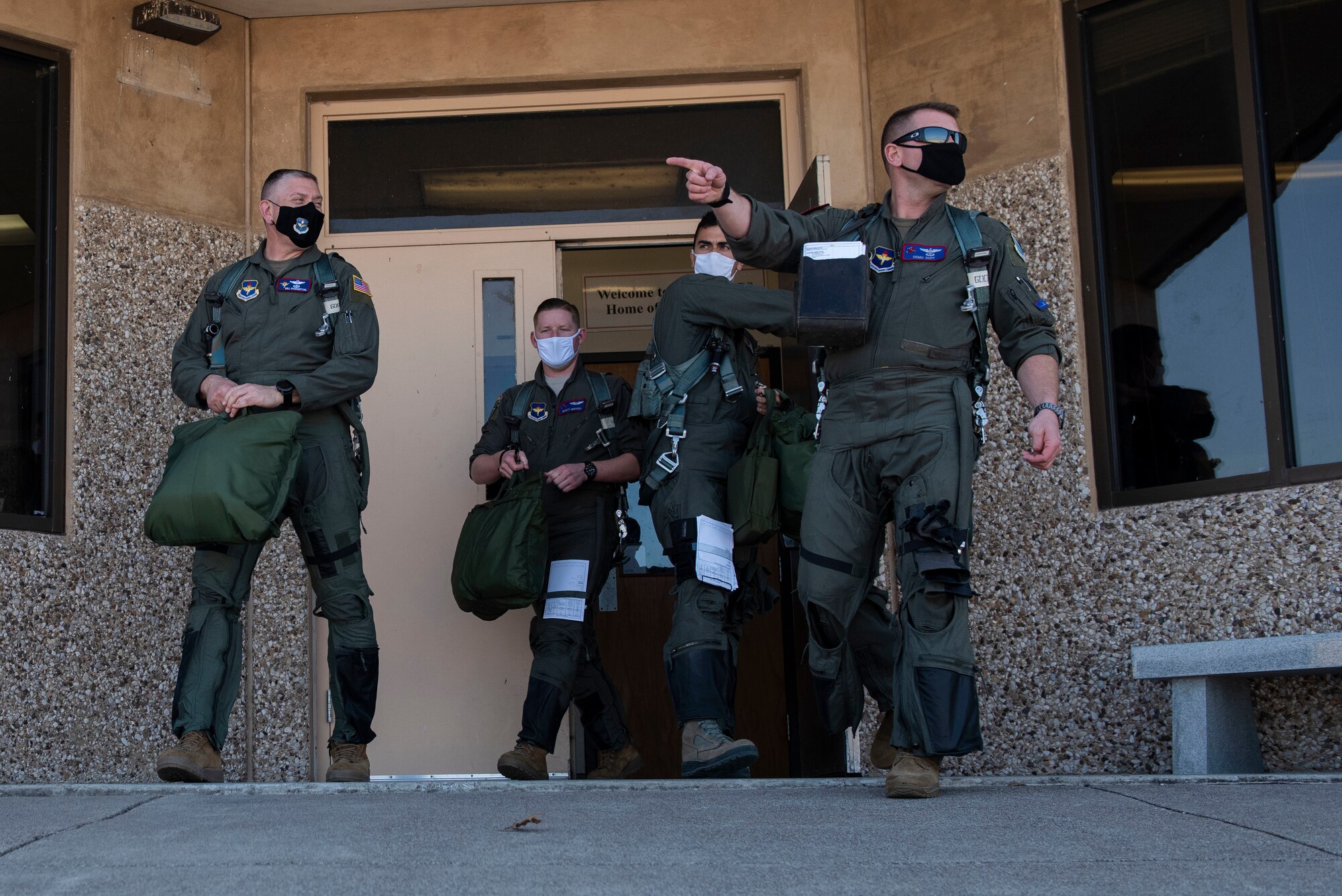 Maj. Gen. William Spangenthal, Air Education and Training Command deputy commander, and his sortie team walk out to their aircraft to take flight at Laughlin Air Force Base, Texas, Feb 9, 2021. The T-6 is the first aircraft student pilots fly, before specializing in either the T-1 Jayhawk or the T-38C Talon. (U.S. Air Force photo by Airman 1st Class David Phaff)