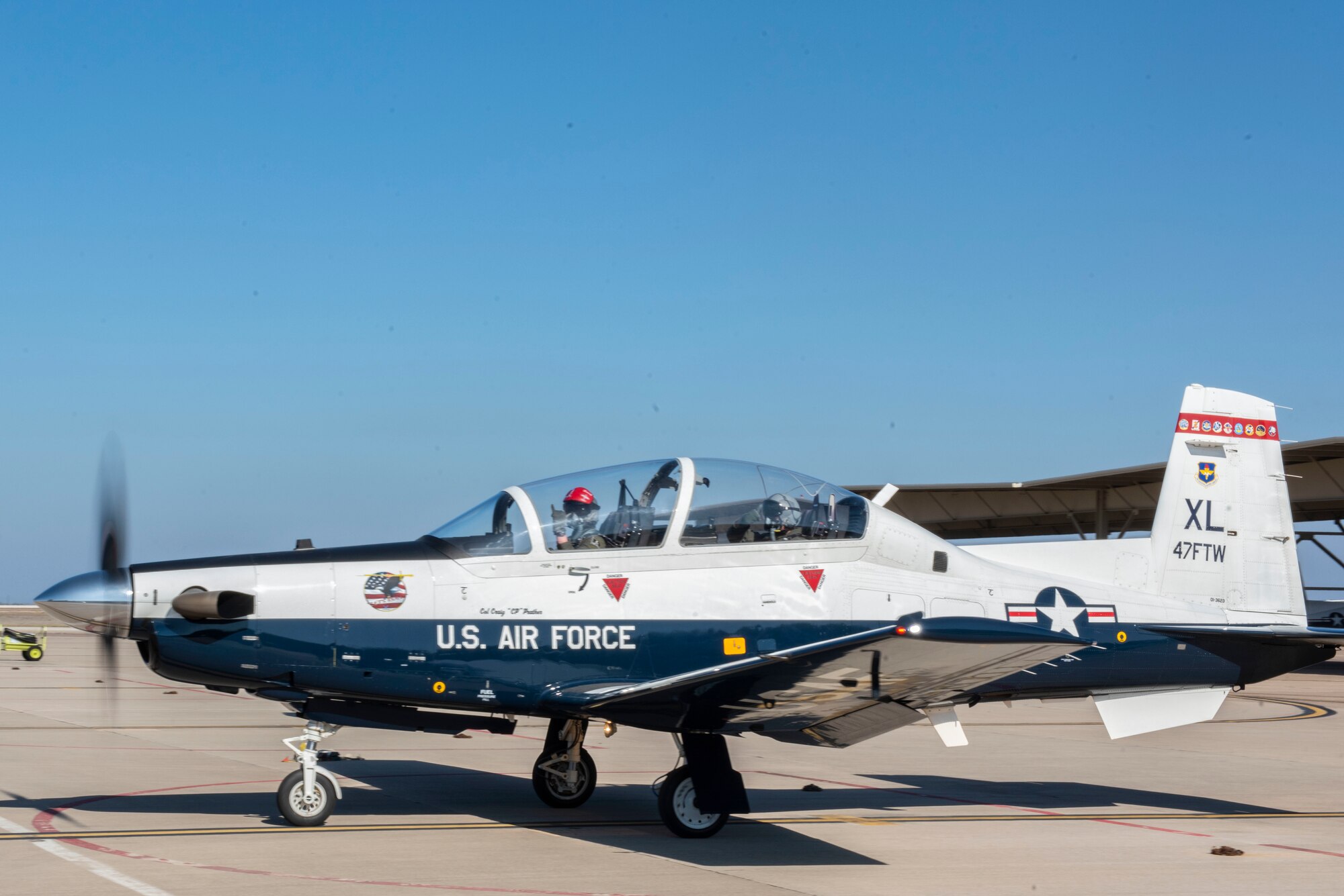 Maj. Gen. William Spangenthal, Air Education and Training Command deputy commander, steps to his T-6A Texan II for a training sortie at Laughlin Air Force Base, Texas, Feb. 9, 2021. The T-6 is the first aircraft student pilots fly, before specializing in either the T-1 Jayhawk or the T-38C Talon. (U.S. Air Force photo by Airman 1st Class David Phaff)