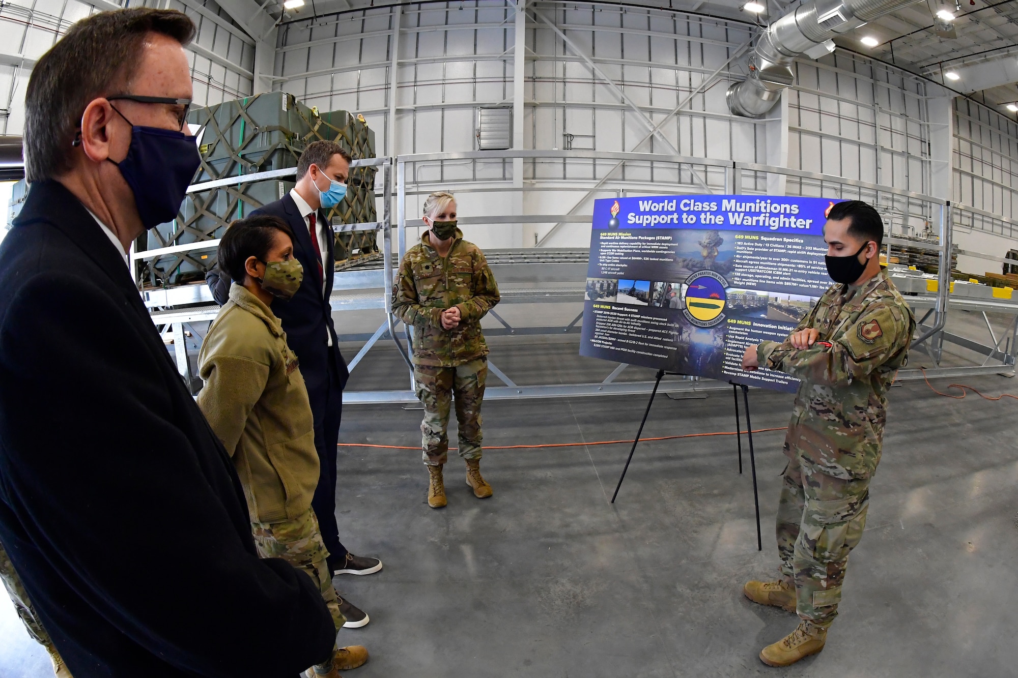 (Left to right) Peter Jenks, district director for Utah Rep. Blake Moore, Col. Jenise Carroll, 75th Air Base Wing commander, Moore, and Lt. Col. Naomi Franchetti, 649th Munitions Squadron commander, listen to Senior Airman Armando Pena, 649th MUNS, during a visit to the squadron at Hill Air Force Base, Utah, Feb. 16, 2021.