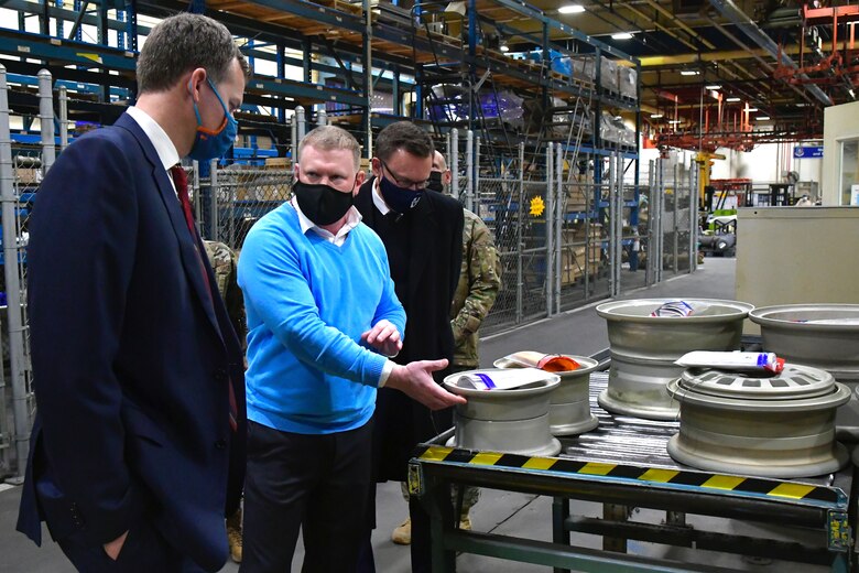 Utah Rep. Blake Moore (left) is briefed by Chad Mather, 532nd Commodities Maintenance Squadron director, about aircraft landing gear production during a visit to the 309th Commodities Maintenance Group at Hill Air Force Base, Utah, Feb. 16, 2021.