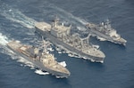 USS Curtis Wilbur conducts trilateral replenishment-at-sea with Japan, France