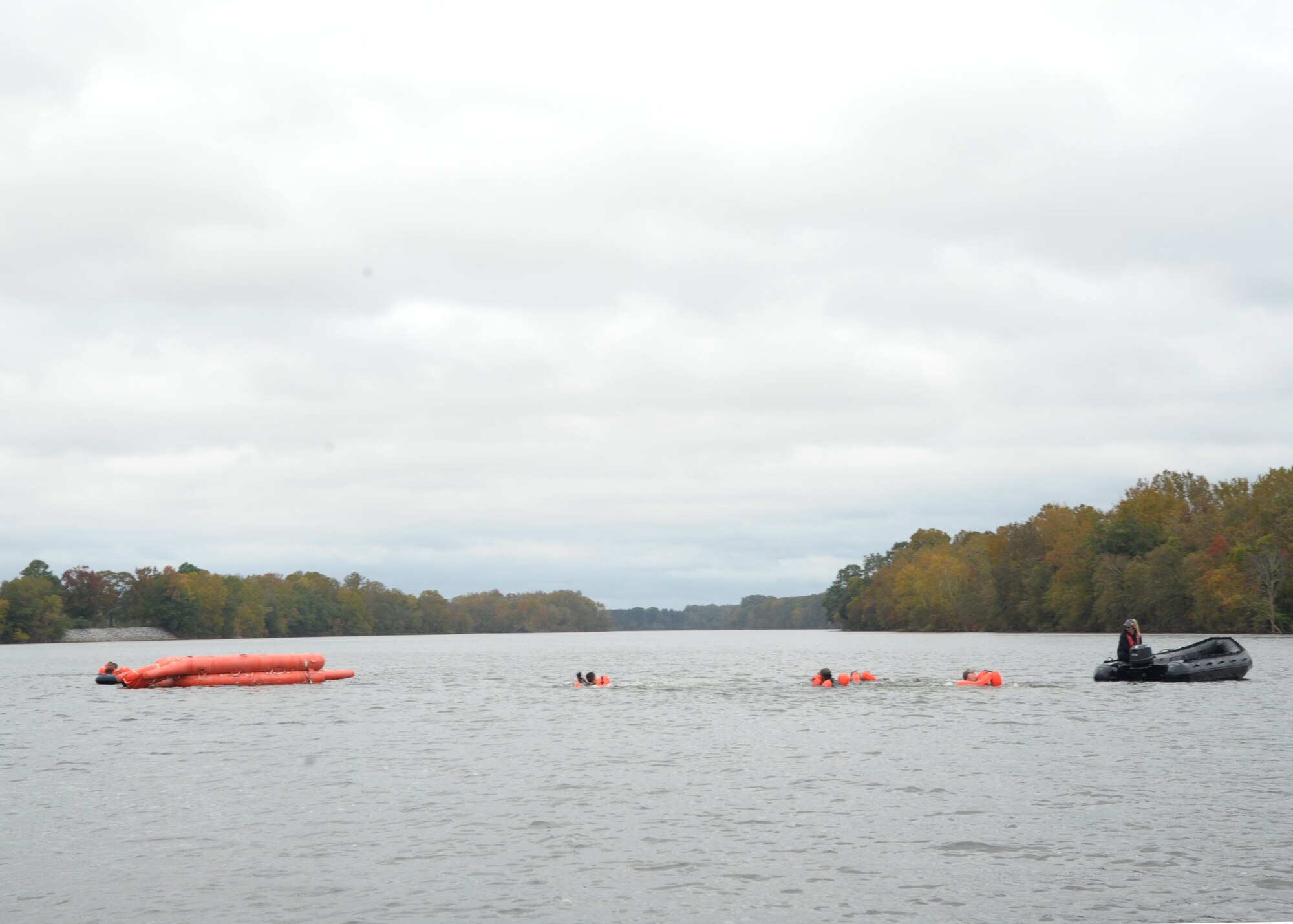 Members of the 908th Operations Group swim to a 20-man life raft after being picked up at their designated extraction point Nov. 8, 2020, at Maxwell Air Force Base, Alabama.