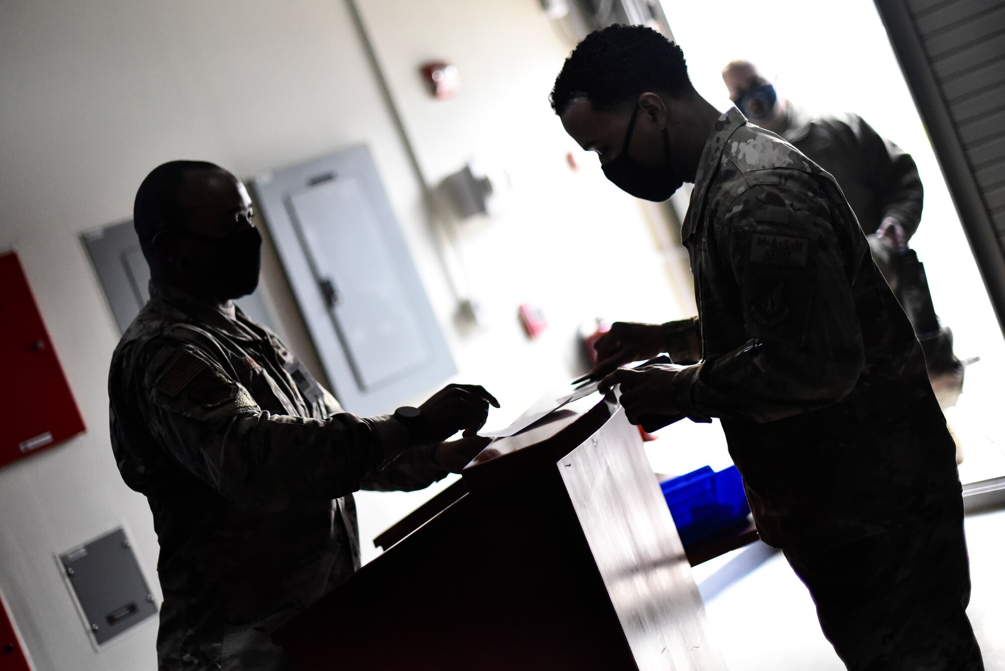 An Air Force medic receives the COVID-19 vaccine.