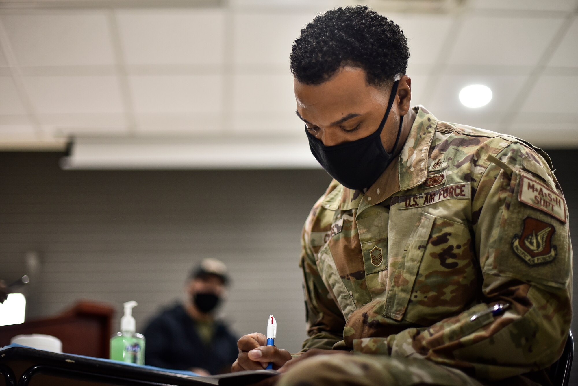 An Air Force medic receives the COVID-19 vaccine.
