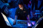 Lt. Jeffrey Alcantara, from Los Angeles, Ca., the anti-terrorism officer assigned to the Arleigh-Burke class guided-missile destroyer USS Barry (DDG 52), stands Ballistic Missile Defense (BMD) officer watch in the ship’s combat information center during bi-lateral exercise Resilient Shield 2021.  Resilient Shield is an annual computer-based Fleet Synthetic Training-Joint (FST-J) exercise focused on BMD, designed to test U.S. Naval tactics, techniques and procedures (TTPs) against potential regional threats while ensuring Japanese and U.S. forces are well-rehearsed in executing those TTPs in the 7th Fleet area of operations. As the U.S. Navy's largest forward-deployed fleet, 7th Fleet employs 50 to 70 ships and submarines across the Western Pacific and Indian Oceans. U.S. 7th Fleet routinely operates and interacts with 35 maritime nations while conducting missions to preserve and protect a free and open Indo-Pacific region.